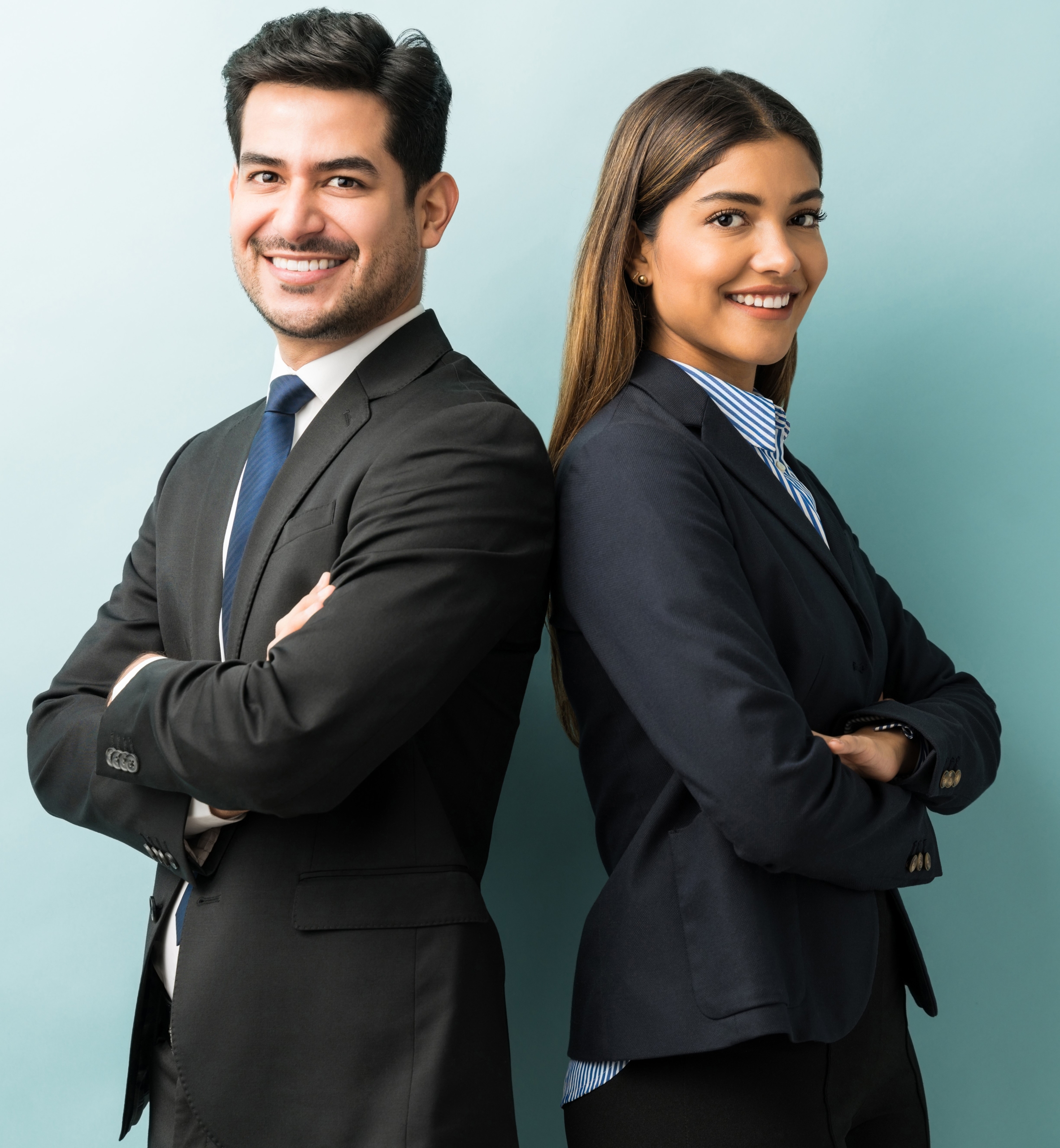 Business Colleagues Standing With Arms Crossed In Studio